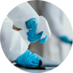 A person disinfecting and cleaning an office