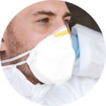 A man wearing a safety disposable respiratory protection mask.