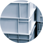 Stacked industrial-grade plastic storage bins for warehouse and facility organization