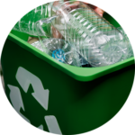 A green plastic trash can filled with recyclable items