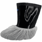A white disposable shoe cover on a black boot