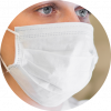 Close-up of a person wearing a 3-ply white disposable face mask for respiratory protection.
