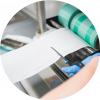 A woman cutting label