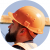 A construction worker wearing an orange hard hat