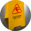 A yellow plastic sign warning for wet floor